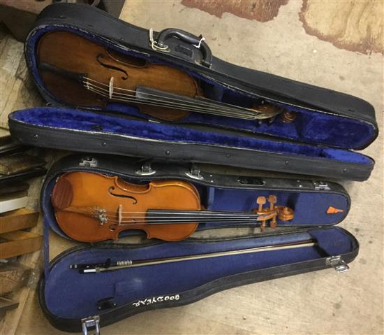 2 violins in cases